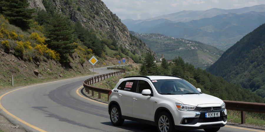 Wypożyczony samochód Mitsubishi ASX na górskiej drodze w Gruzji