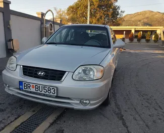 Wynajmij Hyundai Accent 2006 w Czarnogórze. Paliwo: Benzyna. Moc: 85 KM ➤ Koszt od 16 EUR za dobę.