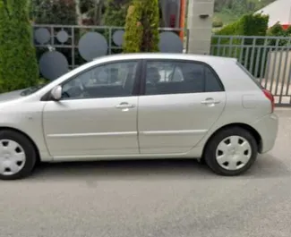 Wynajmij Toyota Corolla 2007 w Albanii. Paliwo: Diesel. Moc: 97 KM ➤ Koszt od 22 EUR za dobę.