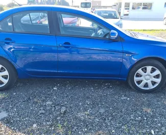 Wynajmij Mitsubishi Lancer 2018 na Cyprze. Paliwo: Benzyna. Moc: 115 KM ➤ Koszt od 27 EUR za dobę.