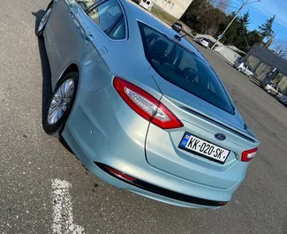 Wnętrze Ford Fusion Sedan do wynajęcia w Gruzji. Doskonały samochód 5-osobowy. ✓ Skrzynia Automatyczna.