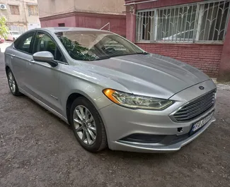 Wynajem samochodu Ford Fusion Sedan nr 7129 (Automatyczna) na lotnisku w Tbilisi, z silnikiem 2,0l. Hybryda ➤ Bezpośrednio od Shota w Gruzji.