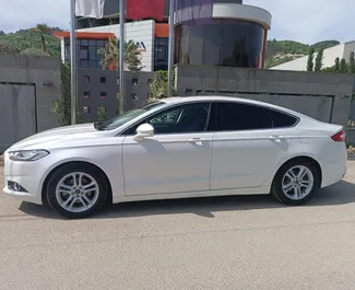 Wynajmij Ford Mondeo 2015 w Albanii. Paliwo: Benzyna. Moc: 149 KM ➤ Koszt od 38 EUR za dobę.