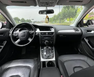 Wnętrze Audi A4 do wynajęcia w Albanii. Doskonały samochód 5-osobowy. ✓ Skrzynia Automatyczna.