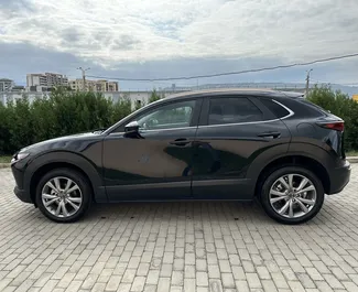 Wynajmij Mazda CX-30 2023 w Gruzji. Paliwo: Benzyna. Moc: 150 KM ➤ Koszt od 145 GEL za dobę.