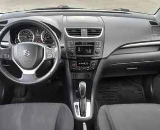 Wynajmij Suzuki Swift 2015 w Albanii. Paliwo: Benzyna. Moc: 110 KM ➤ Koszt od 20 EUR za dobę.