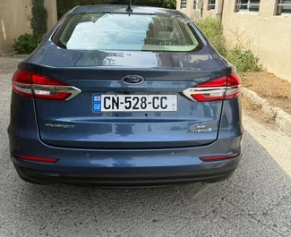Wnętrze Ford Fusion Sedan do wynajęcia w Gruzji. Doskonały samochód 5-osobowy. ✓ Skrzynia Automatyczna.