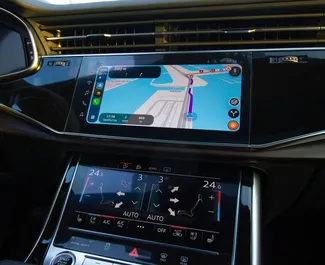 Wnętrze Audi Q7 do wynajęcia w ZEA. Doskonały samochód 7-osobowy. ✓ Skrzynia Automatyczna.