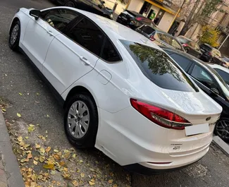 Wynajmij Ford Fusion Sedan 2020 w Armenii. Paliwo: Benzyna. Moc: 185 KM ➤ Koszt od 70 USD za dobę.