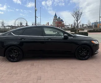 Ford Fusion Sedan – samochód kategorii Komfort na wynajem w Armenii ✓ Depozyt 190 USD ✓ Ubezpieczenie: OC, CDW, SCDW, FDW, Pasażerowie, Od Kradzieży, Zagranica, Młody, Bez Depozytu.