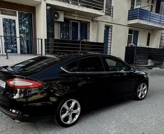 Wnętrze Ford Fusion Sedan do wynajęcia w Gruzji. Doskonały samochód 5-osobowy. ✓ Skrzynia Automatyczna.