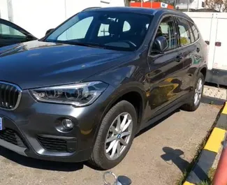 Wynajem samochodu BMW X1 nr 15686 (Automatyczna) na lotnisku w Podgoricy, z silnikiem 1,5l. Diesel ➤ Bezpośrednio od Yan w Czarnogórze.